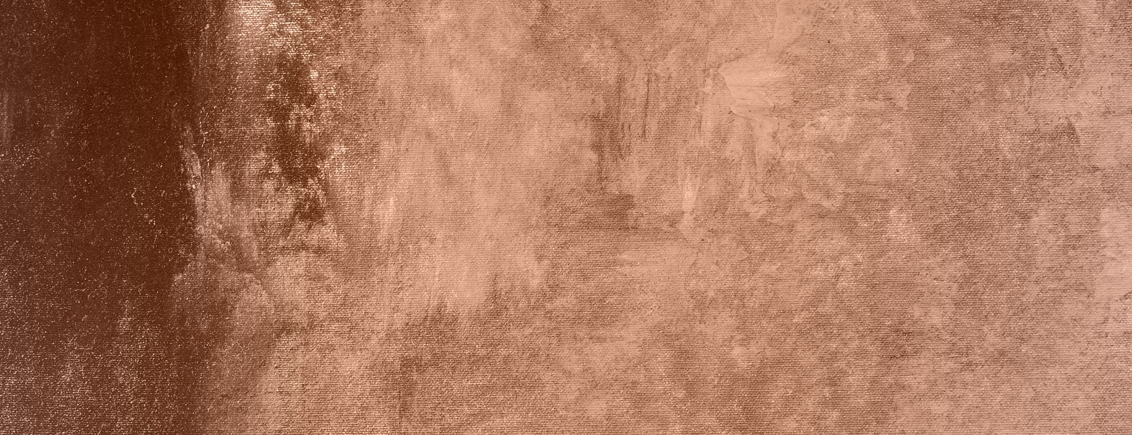 Textured brown surface with subtle variations.