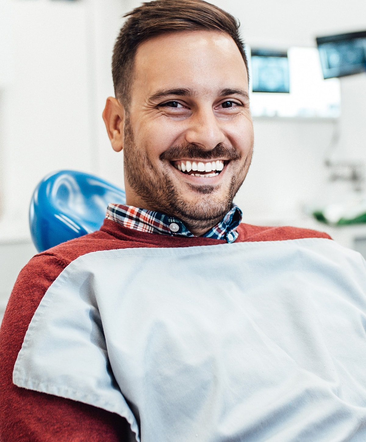 Smiling man at the dentist's office.