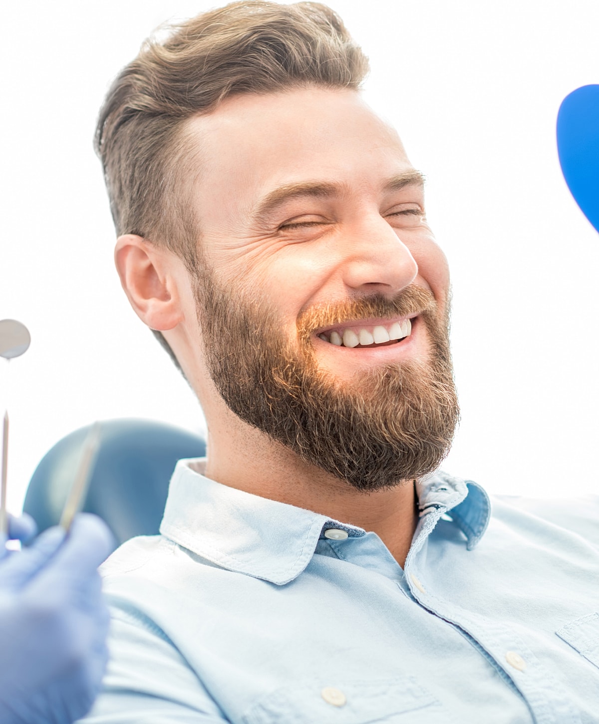 Smiling man enjoying a dental check-up.