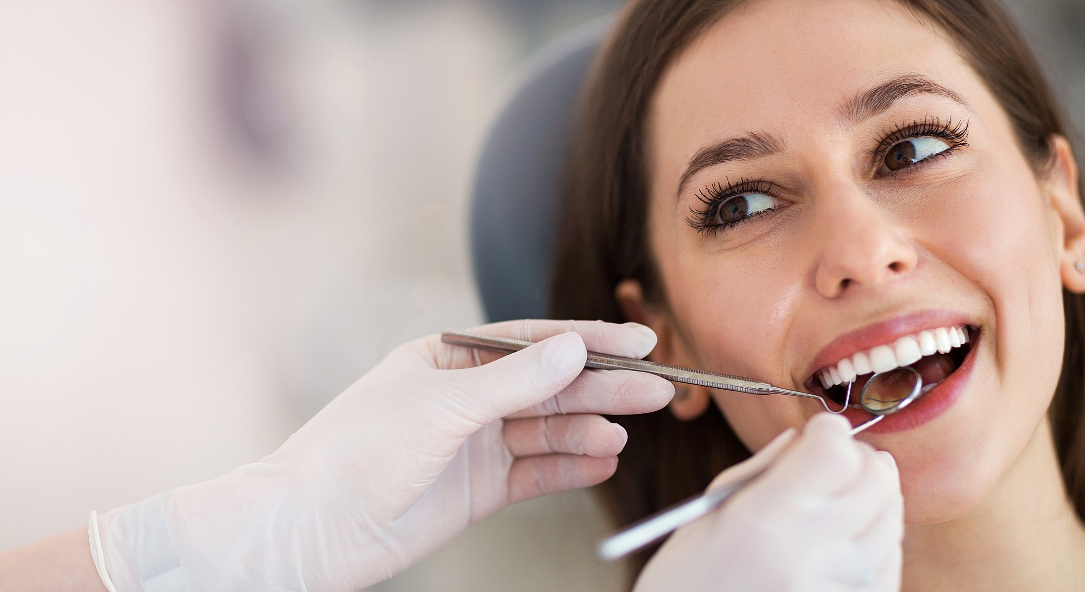 Patient receiving dental check-up and treatment.